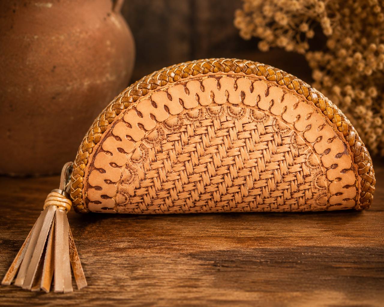 Half moon basketweave tooled leather wallet with tassel.