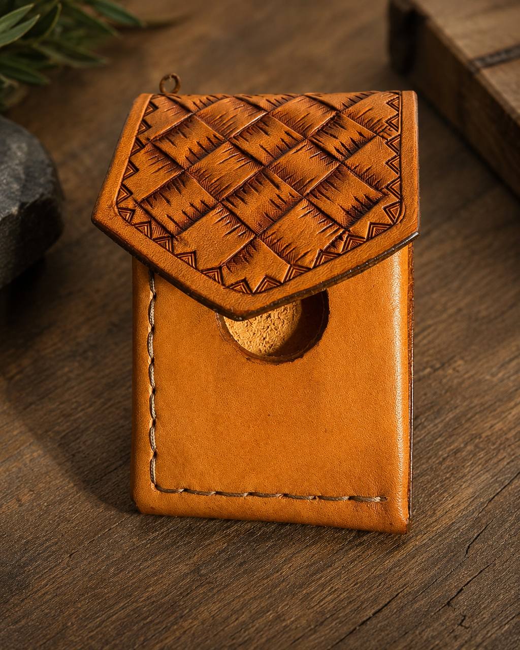 Brown basketweave tooled leather pouch.
