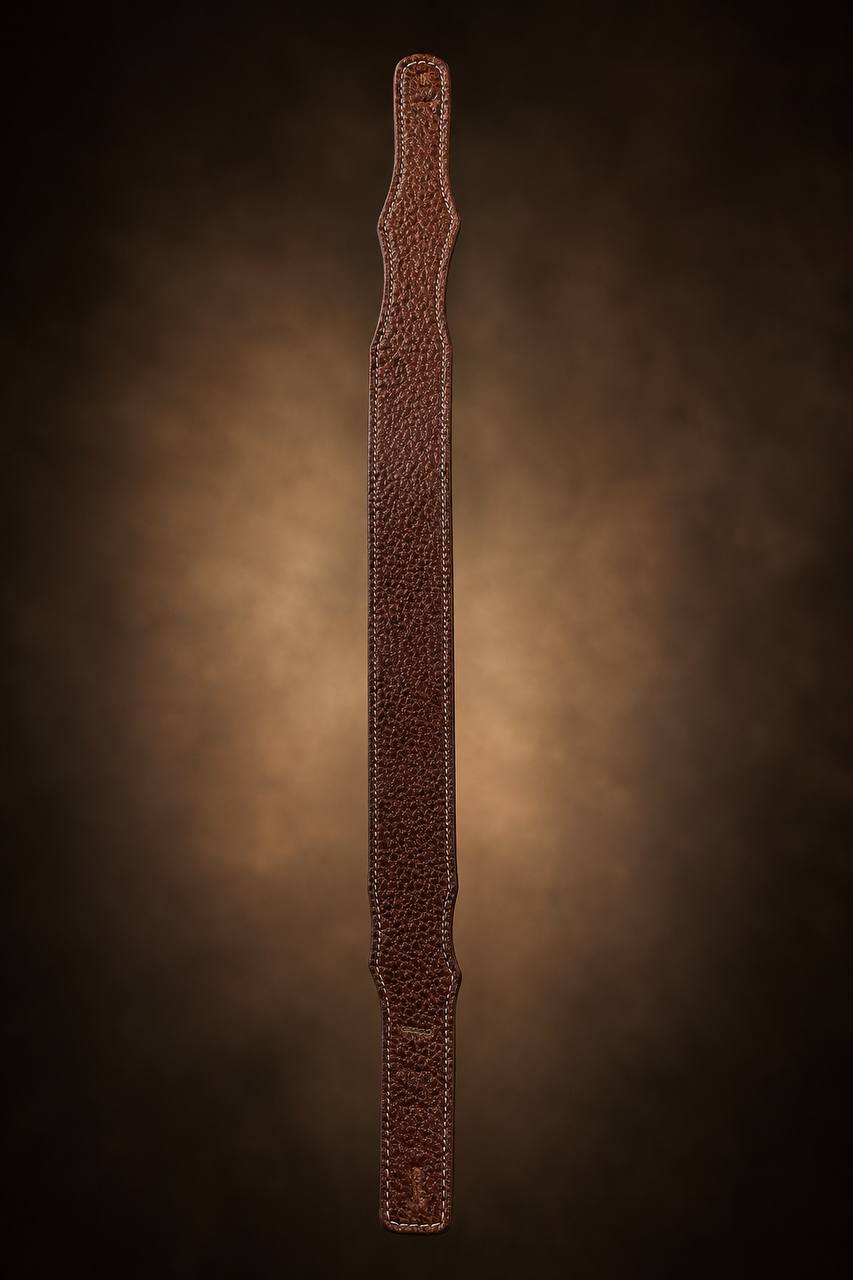 Long dark pebbled leather guitar strap.