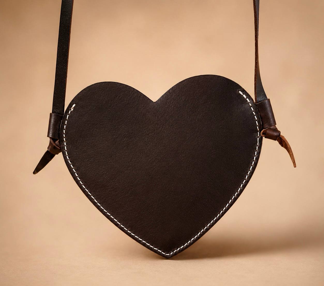Back of heart shaped leather purse.