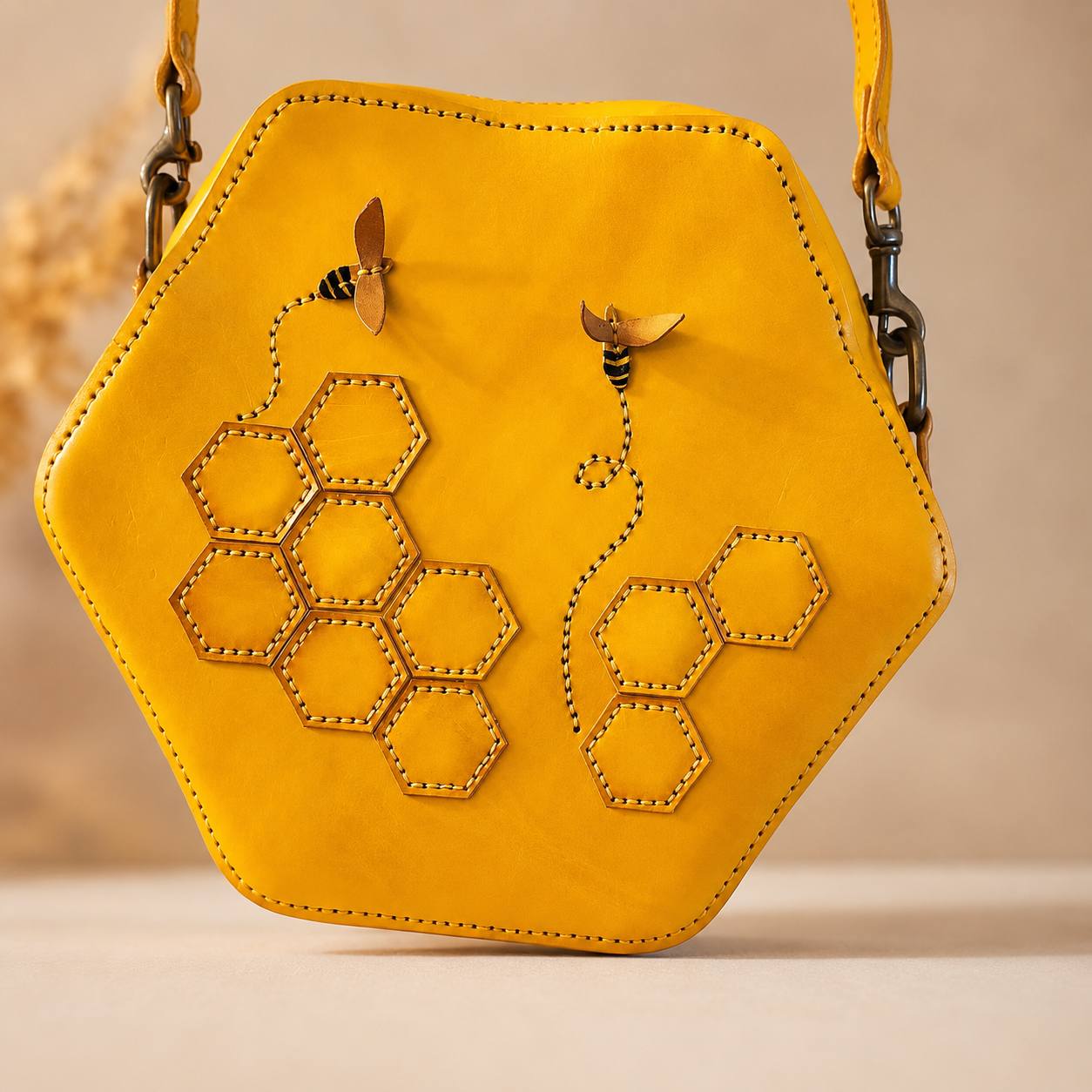 Yellow honeycomb themed leather purse.
