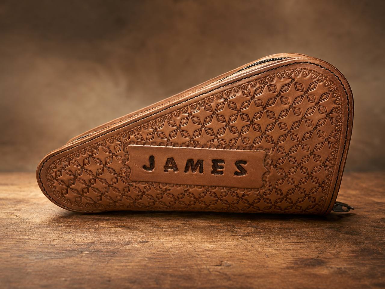 Tooled leather holster case with name panel.