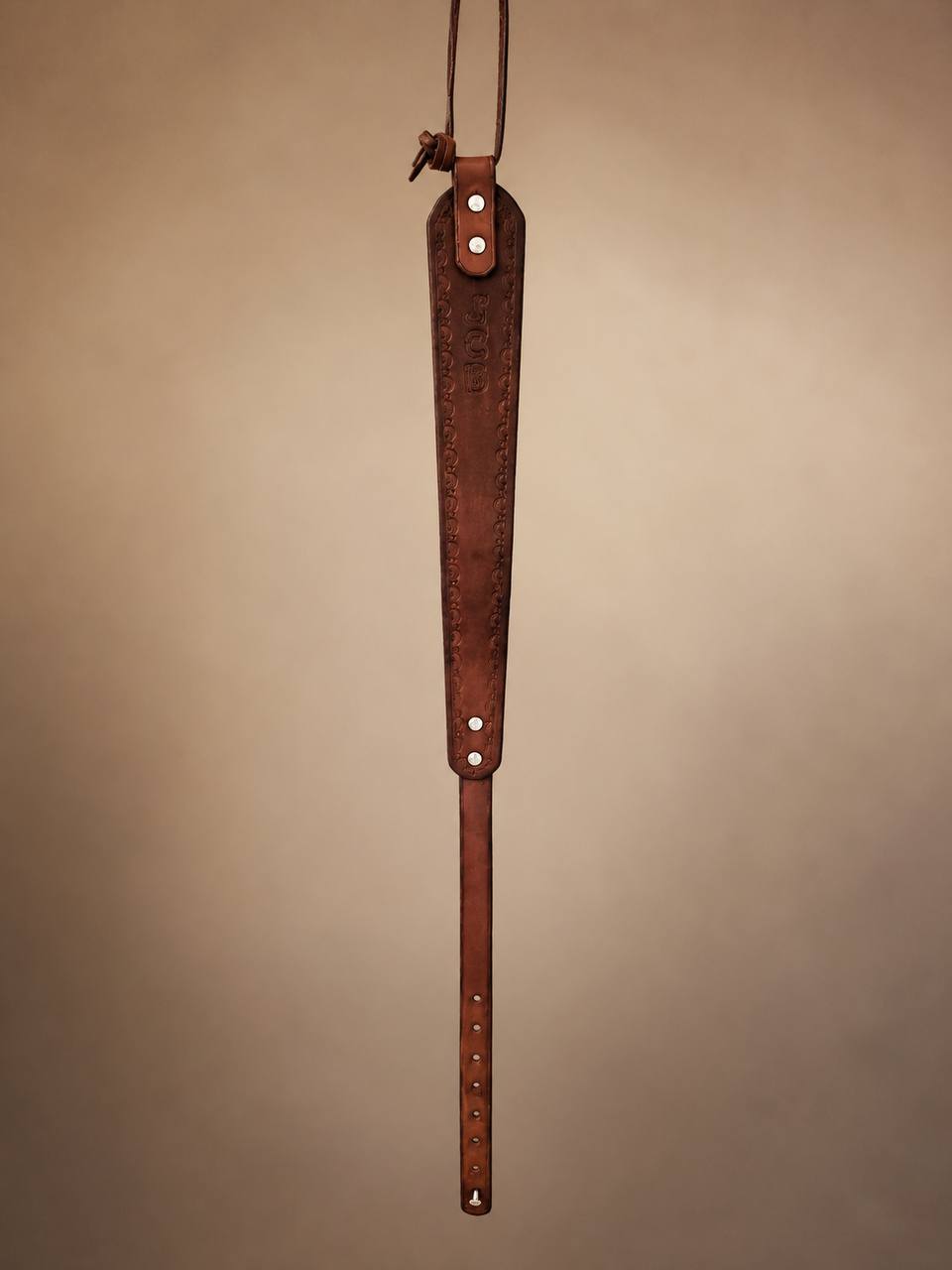 Full length JCB tooled leather rifle strap.